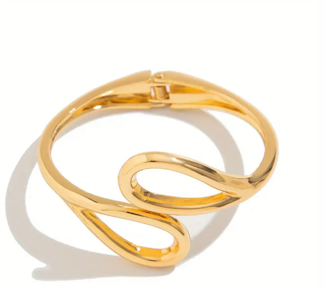 Sculptural and striking, gold-toned cuff bracelet