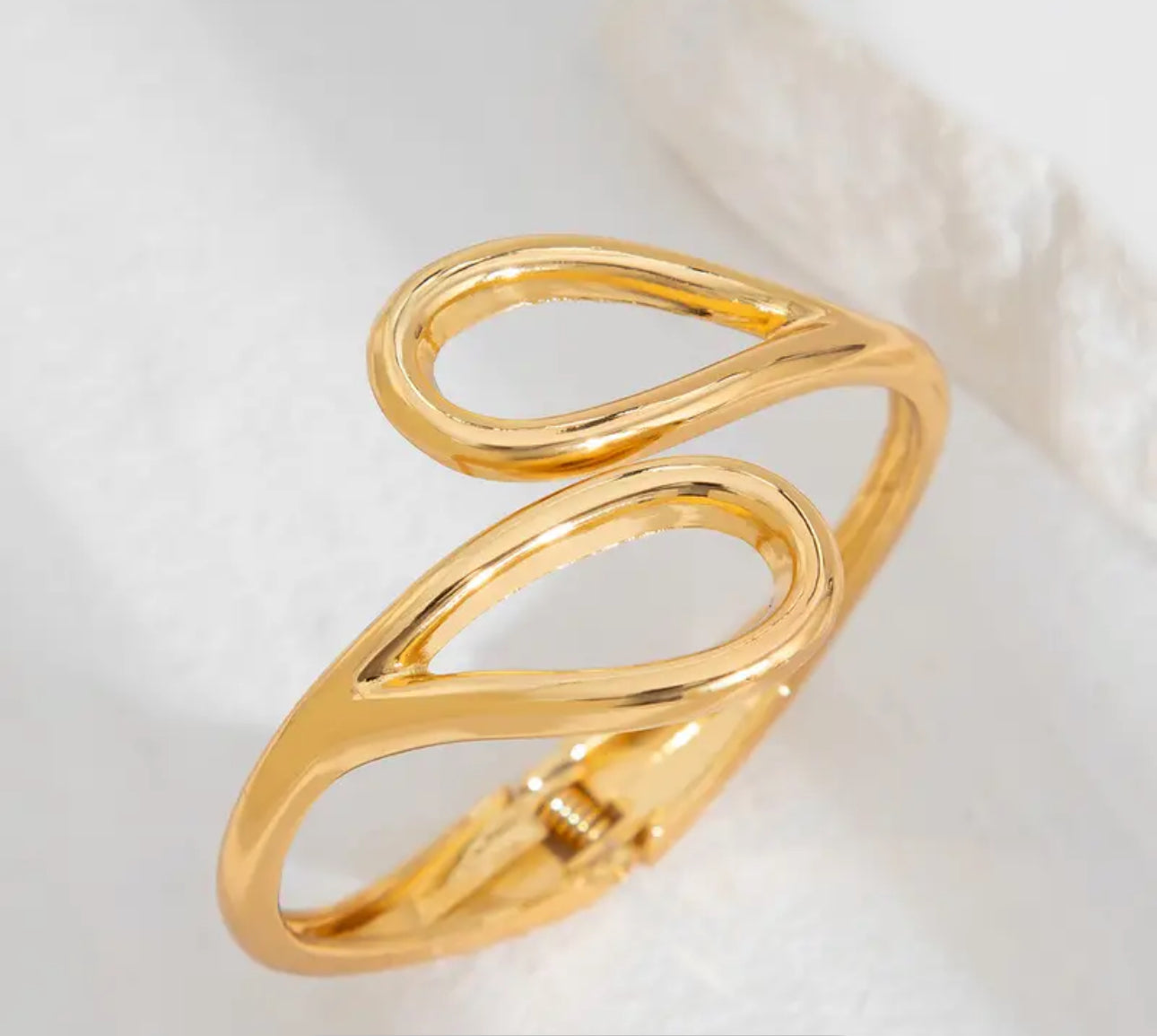 Sculptural and striking, gold-toned cuff bracelet