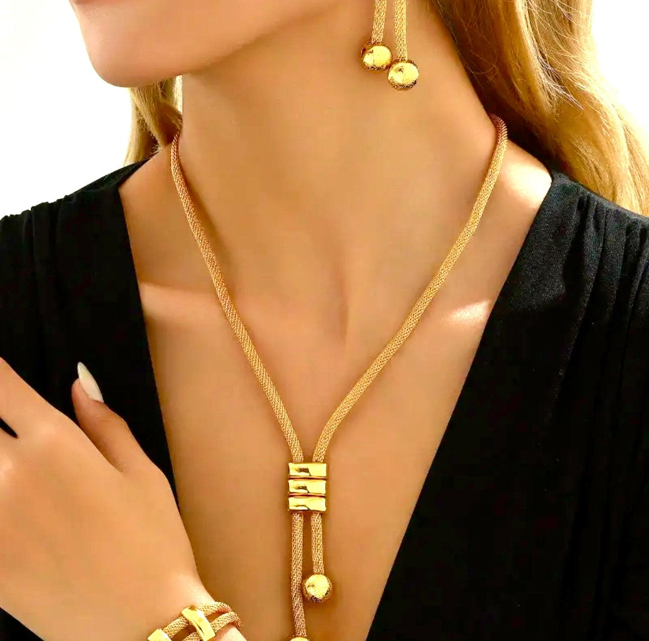 Sleek and sophisticated,  gold-toned jewelry set